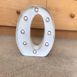 Metal letter “O” light up sign